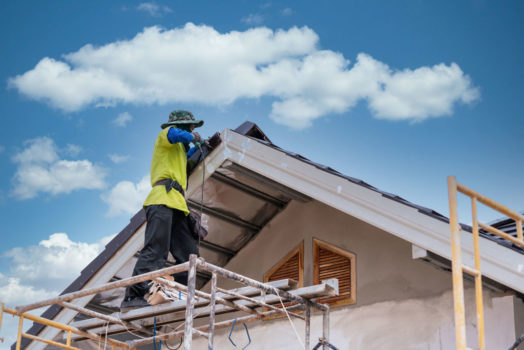 Construction worker install install new ceramic tile roof, Roofi